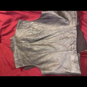 Leather vest with gold zippers